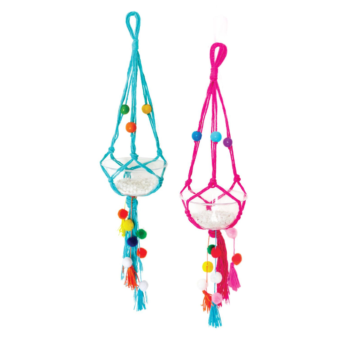 Lifestyle image of two completed Macrame Plant Hangers. One is blue string and the other is pink string.