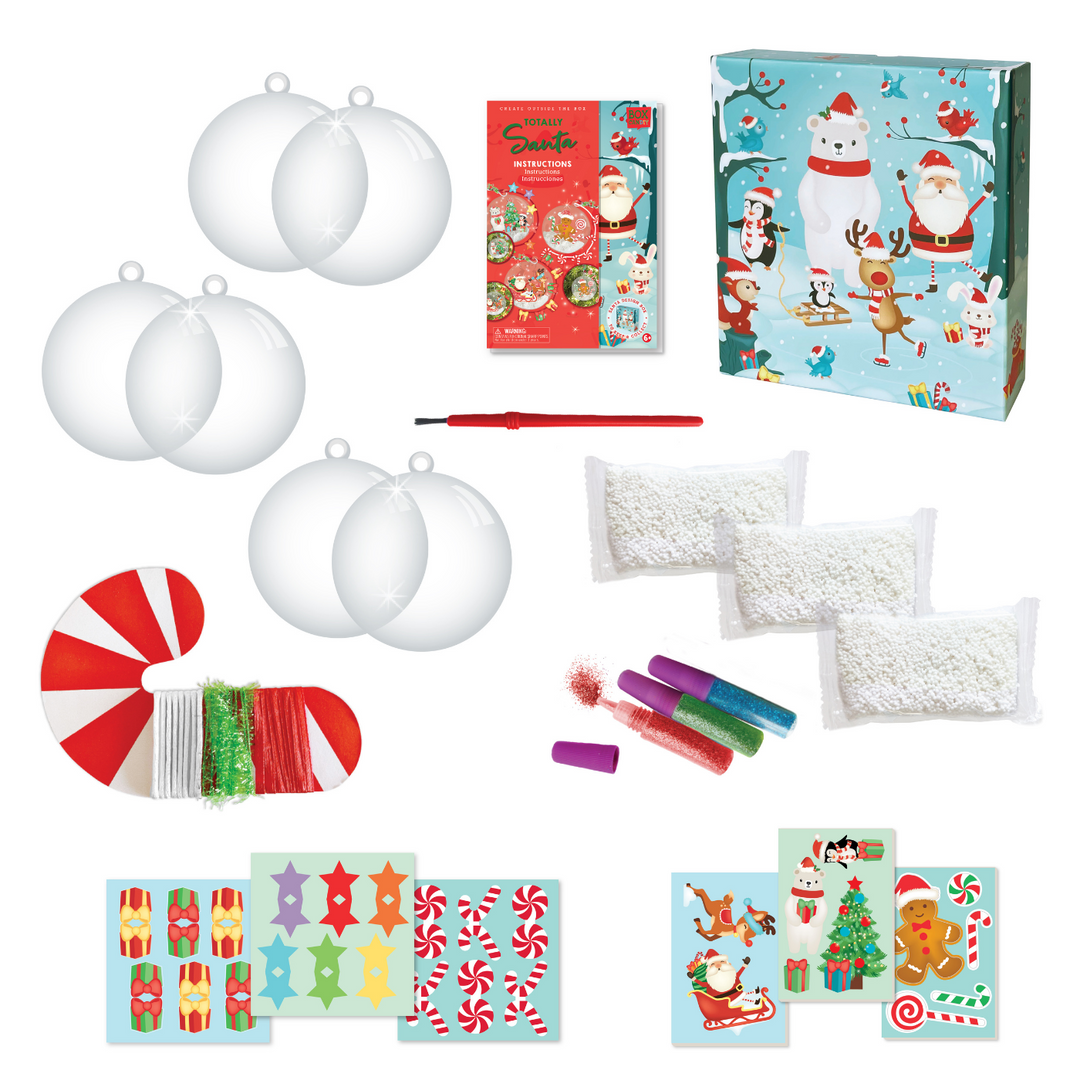 Image of the material which Includes: 3 (3.5 inch) clear ornament balls, white play foam “snow”, cardboard press out figures, decorative candy cane roll with 3 assorted ribbons and strings, brush, 3 tubes of powder glitter, glitter stickers and instructions, all in a beautiful keepsake storage box made from recycled cardboard.