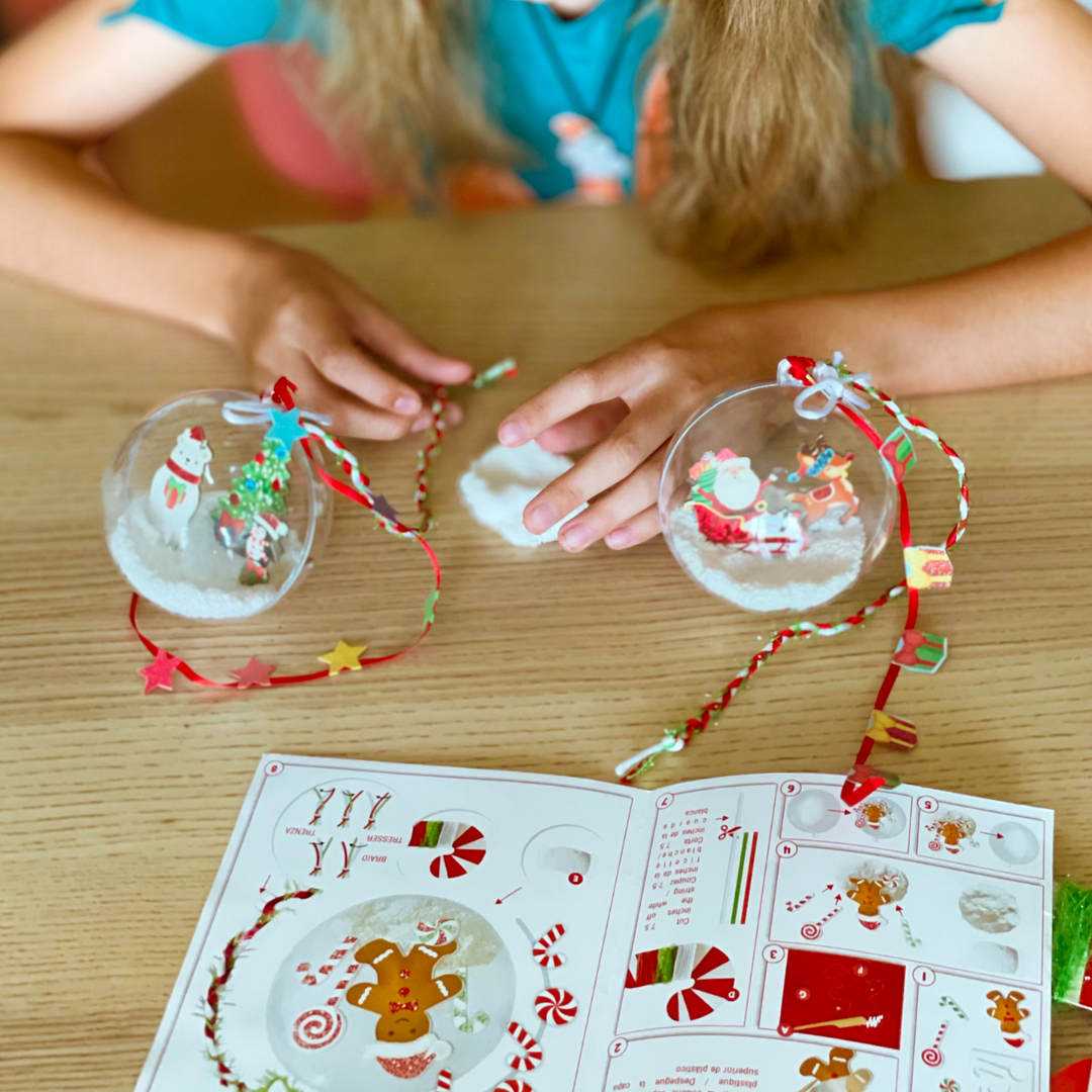 Lifestyle image of a child creating Christmas ornaments. 