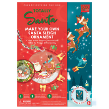 Load image into Gallery viewer, Boxed Image of Totally Santa Make Your Own  Santa Sleigh Ornament.
