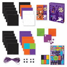 Load image into Gallery viewer, Image of the materials that come which the totally spooky origami set which Includes: 20 sheets of origami paper with pre-printed folding lines, 3 glitter sticker sheets and 2 colored sticker sheets, 4 sets ”googly” eyes, colored craft cord and instructions, all in a keepsake storage box made from recycled cardboard.
