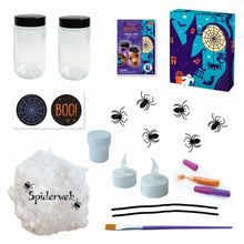 Load image into Gallery viewer, Image of the materials inside of the spooky spider night light jar set which Includes: 2 plastic jars, 2 flameless multi-colored LED candles with batteries, 2 tubes of powder glitter, stretchable “spider webs”, 6 plastic spiders, 2 black pipe cleaners, stickers, 1 brush, 1 container of glue and instructions, all in a keepsake storage box made from recycled cardboard.
