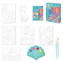 Load image into Gallery viewer, Image of the materials in Totally Mermaids Watercolor Art Set which Includes: 5 watercolor sheets, 1 watercolor door hanger, 1 wide tip and 1 fine tip brush, 1 seashell-shaped paint palette with 6 watercolors and instructions, all in an enchanting keepsake storage box made from recycled cardboard.
